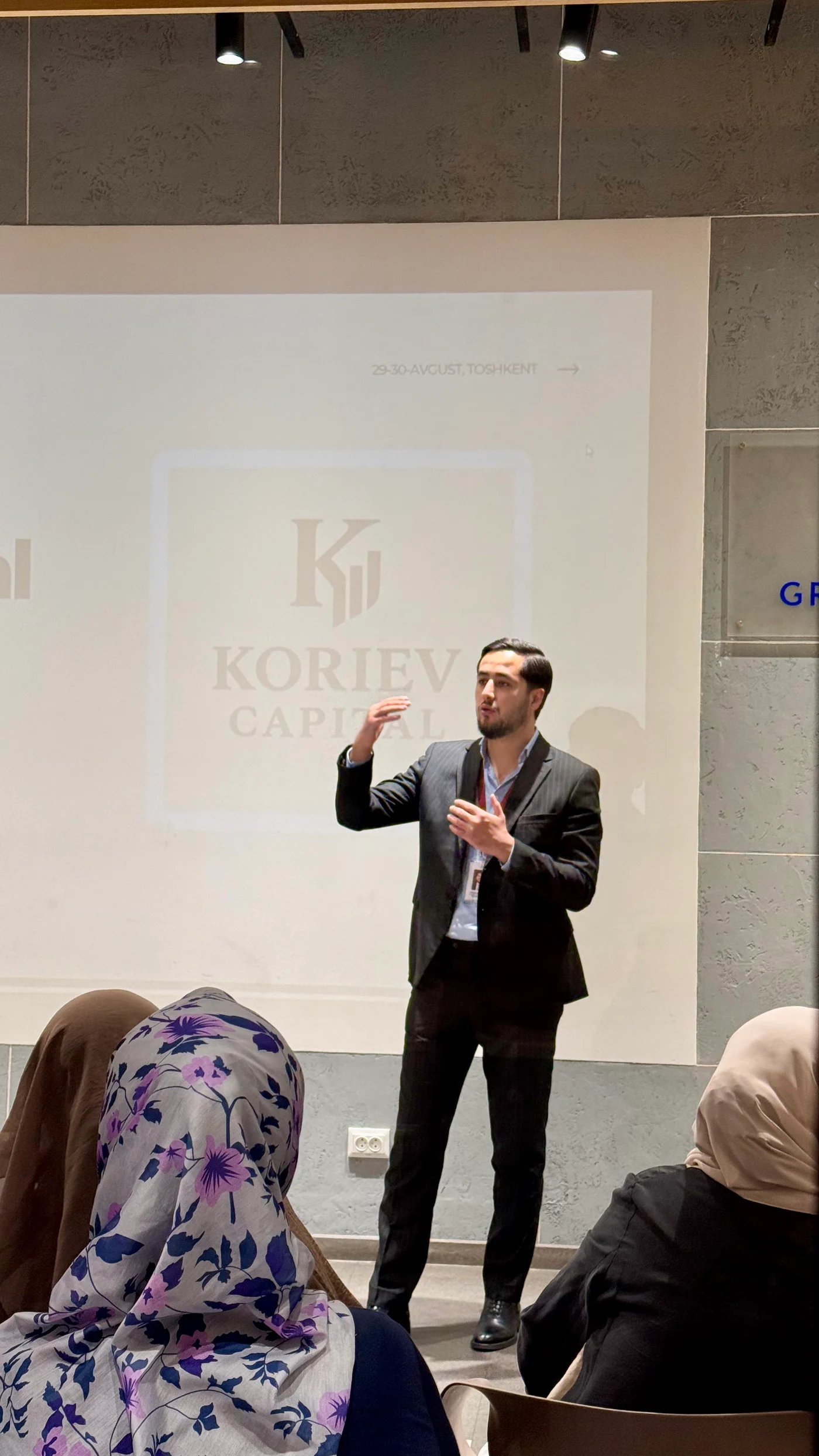 Makhmud Koriev speaking at a property event
